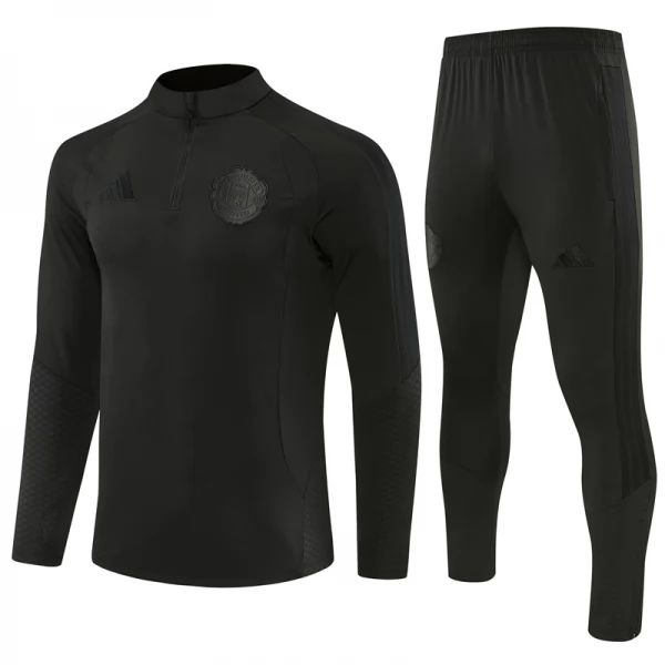Manchester United Trenirka Dječji 2026/27 - 1-4 Zip Crna Manchester United Trenirka Dječji 2026/27 - 1-4 Zip Crna